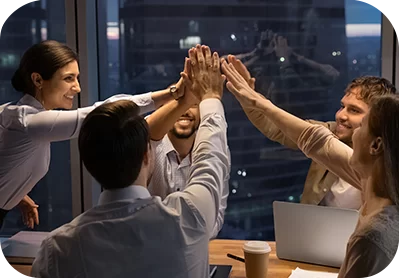 Team high-fiving in office